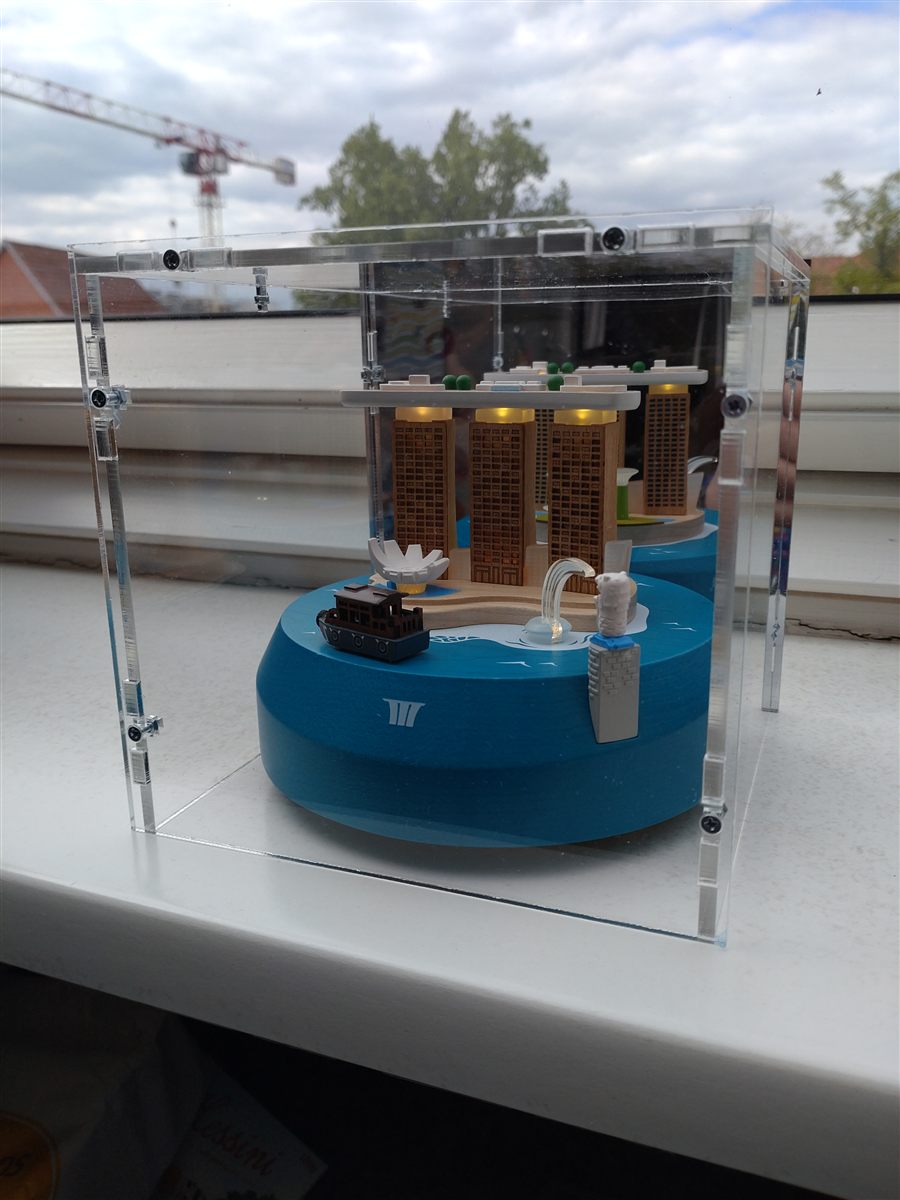 Real customer photo: LEGO model under a Sora acrylic display case in a living room