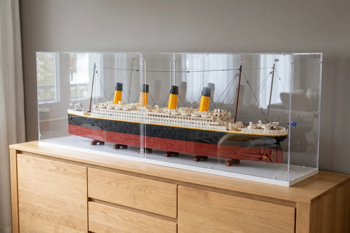 Very long ocean liner model under a two-part split acrylic display case