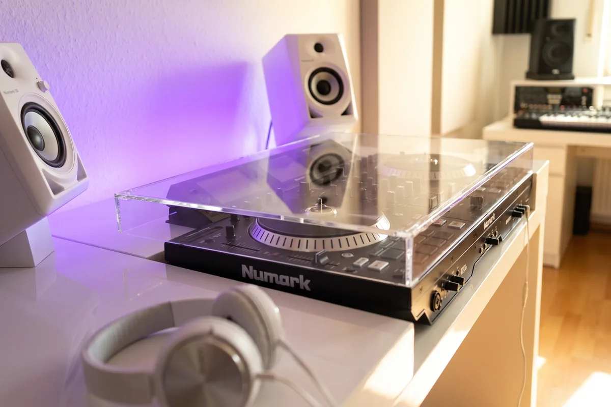 DJ turntable in direct drive format under a removable acrylic cover