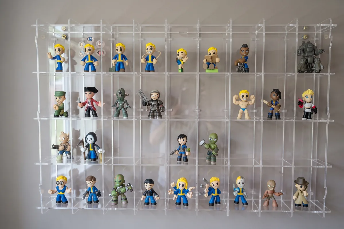 Oversize made-to-measure display cabinet on the wall, filled with collectors' figures