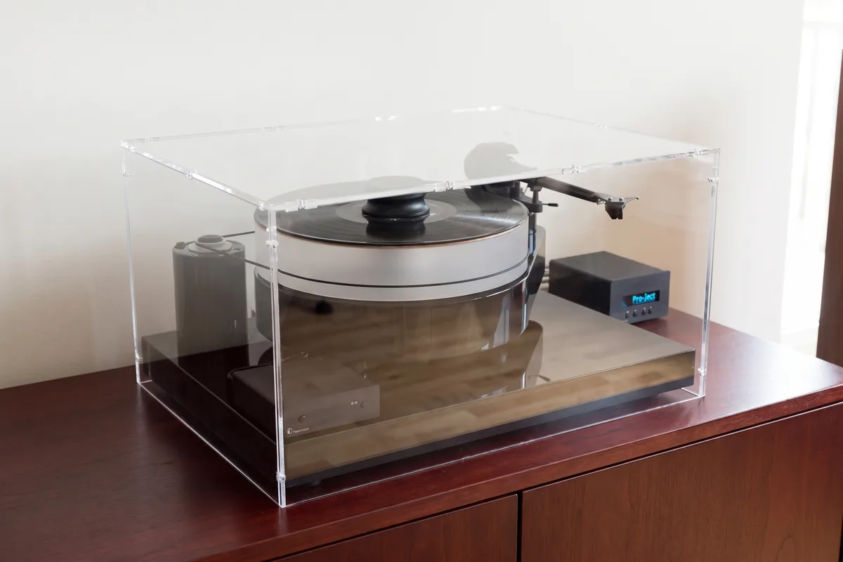 Modern turntable without a factory cover under a made-to-measure acrylic cover
