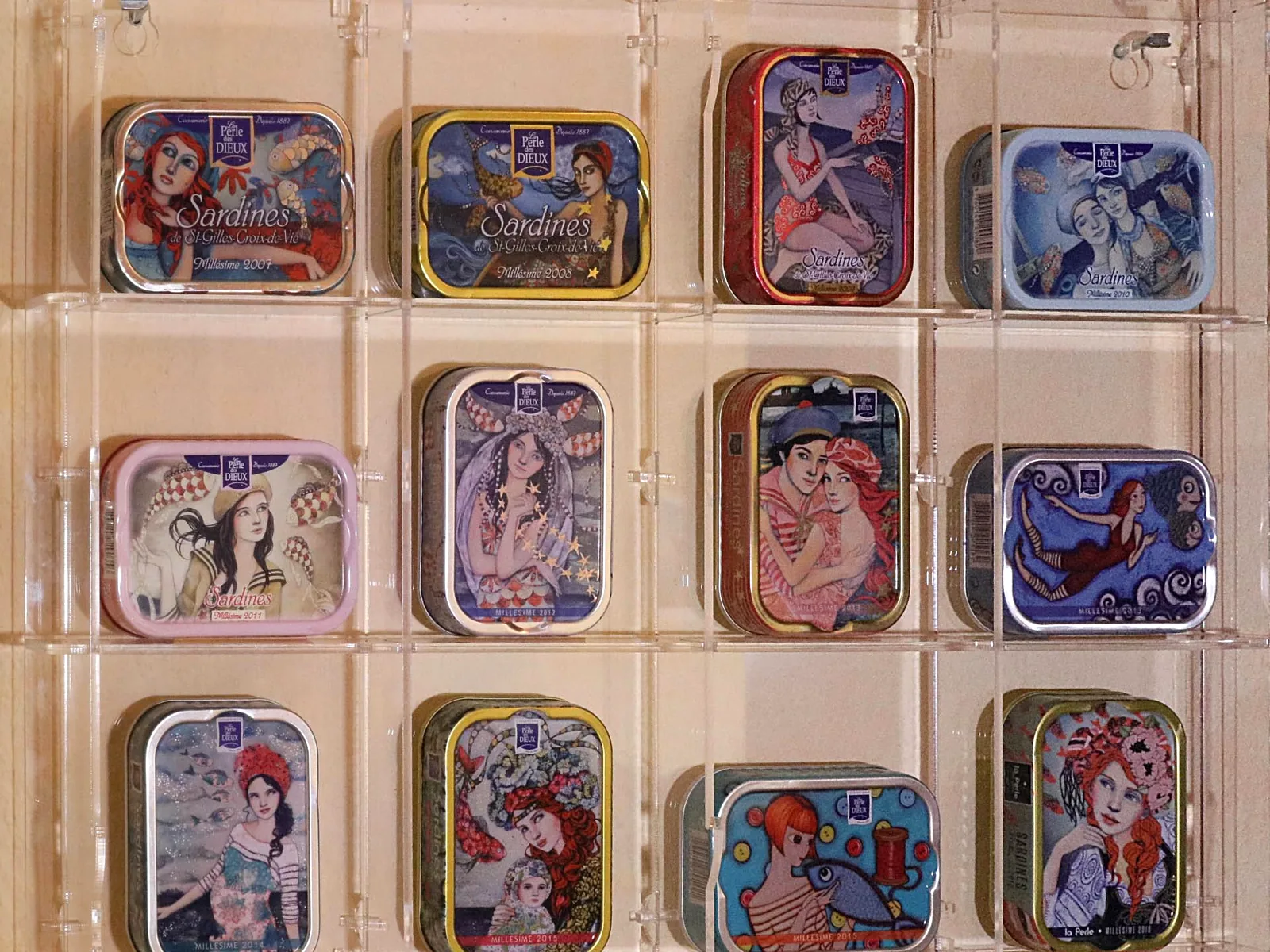 Display cabinet with 12 compartments for a collection of French vintage-edition sardine tins
