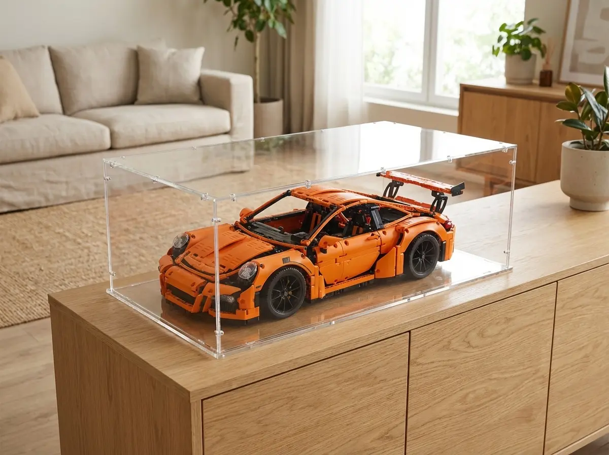 LEGO Technic Porsche under a Sora acrylic display case